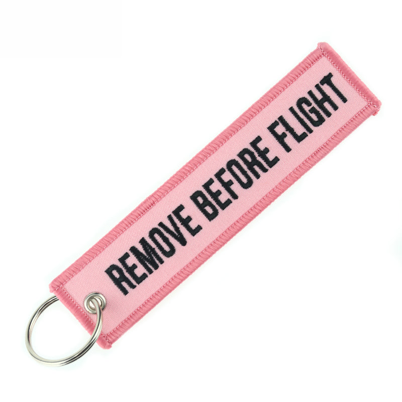 Aéo - Porte Clés Flamme Remove Before Flight Rose