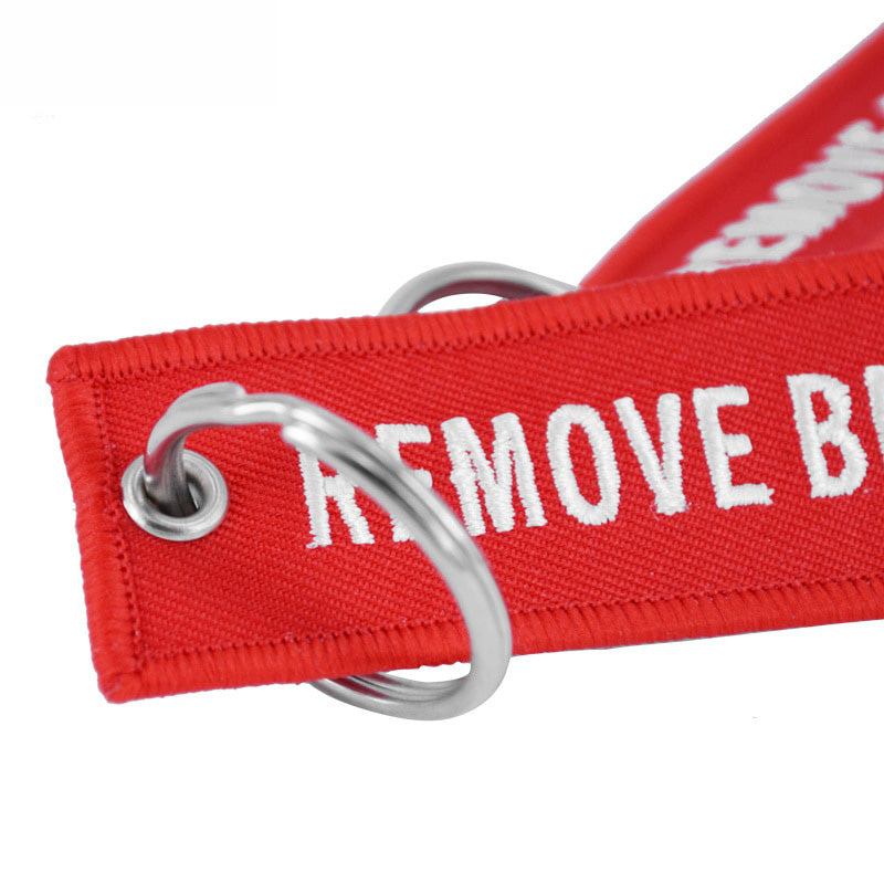 Aéo - Porte Flamme Remove Before Flight Rouge