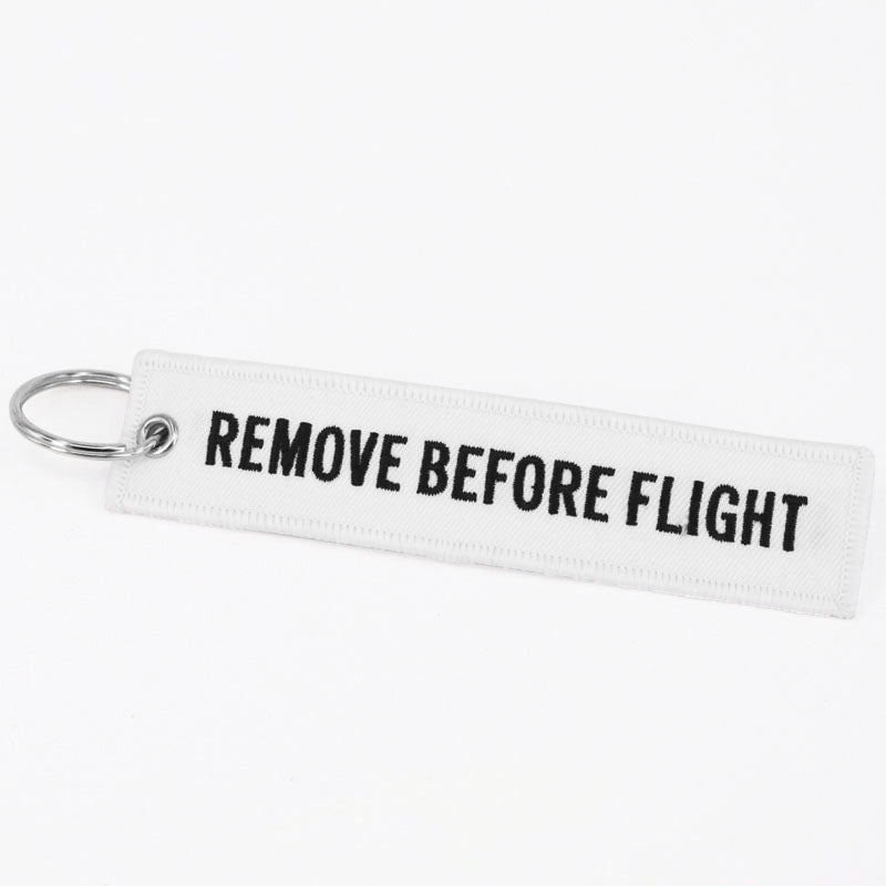 Flamme Remove Before Flight blanche