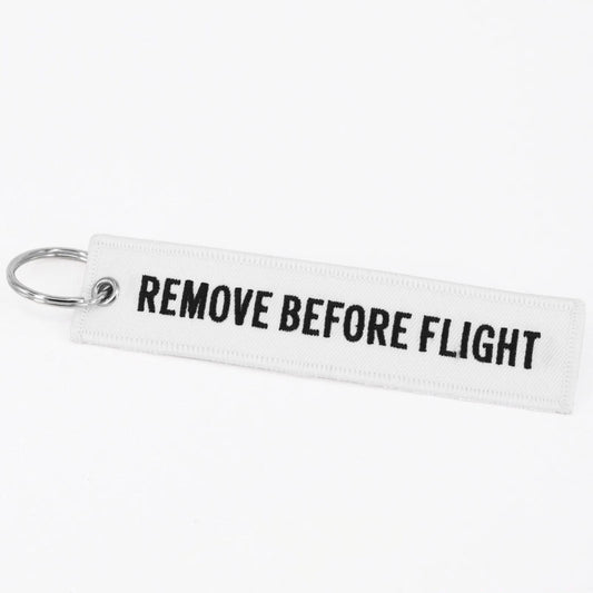 Flamme Remove Before Flight blanche