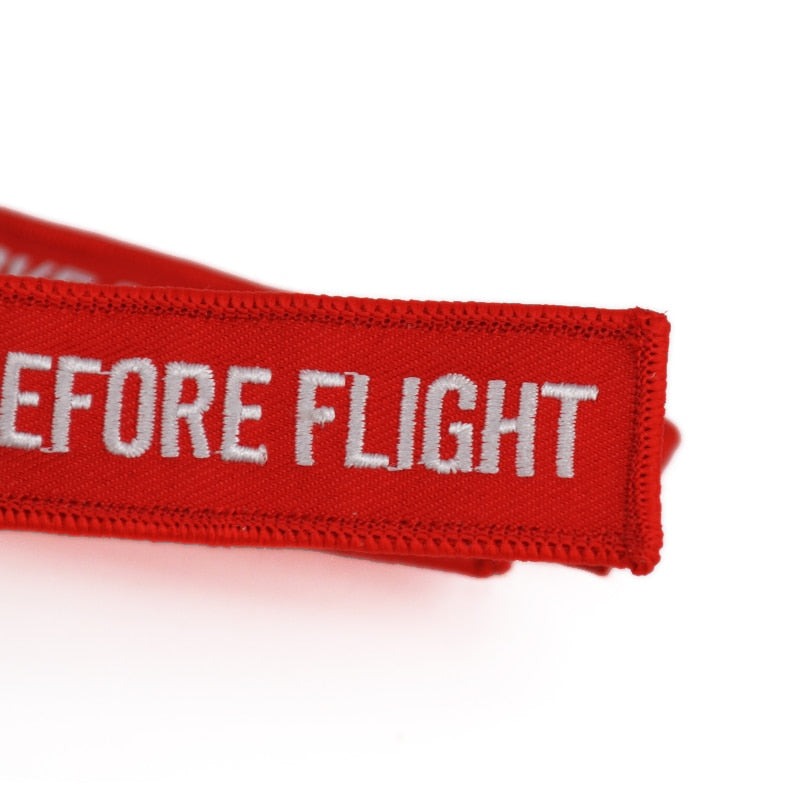 lot porte clés remove before flight aviation rouge brodé